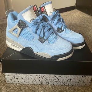Blue and black Jordan Retro 4s. Size 4Y. Excellent condition, only worn twice.